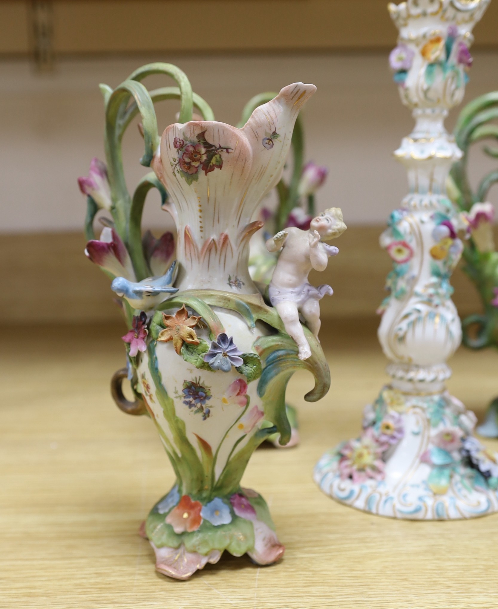 A group of 19th century and later continental floral encrusted porcelain items
